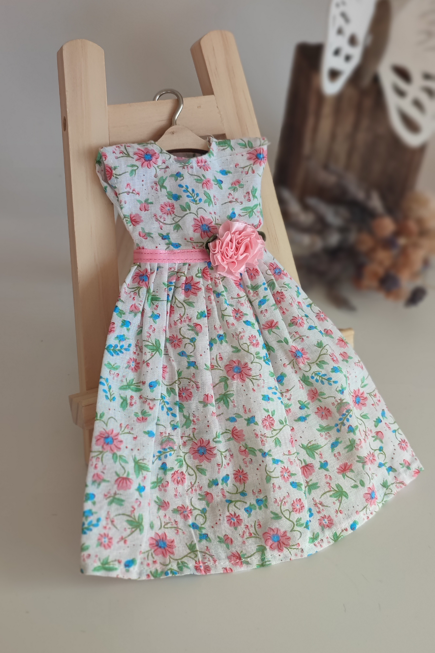 White doll dress with light flowers